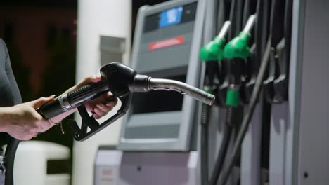 Person-holding-a-black-diesel-fuel-handle-which-is-out-of-service,-because-there-is-petrol-shortage