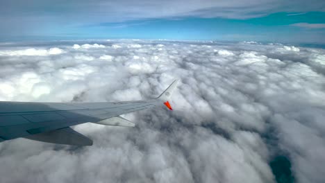 shot-of-window-seat-over-clouds-in-Mexico-city