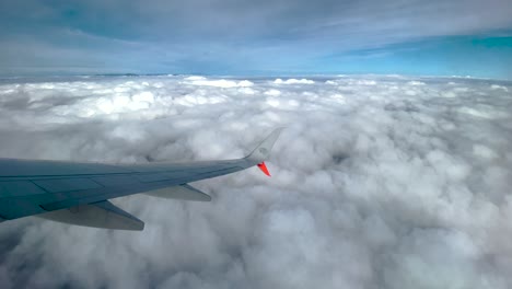 shot-of-window-seat-over-clouds-in-Mexico