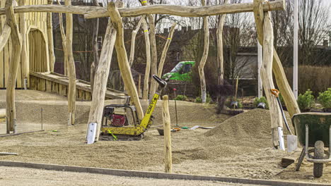 Construction-Workers-Putting-Gravel-On-The-Ground-In-The-Playground