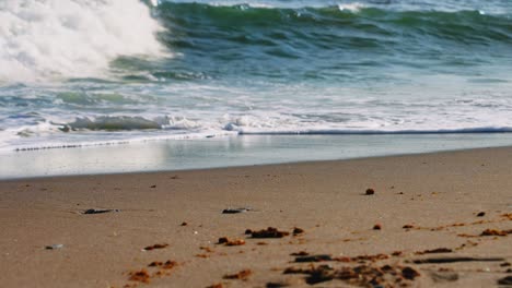 Waves-crashing-at-a-sandy-beach