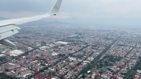 shot-from-the-plane-window-during-landing-over-mexico-city