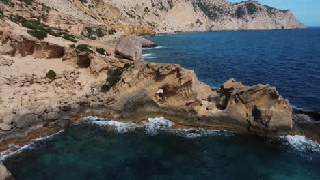 Aerial-view-of-a-natural-geological-formation-on-the-coast-of-Ibiza