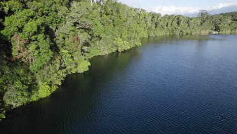 Ripples-Of-Water-At-Lake-Eacham-In-Atherton-Tableland,-Queensland,-Australia---drone-shot