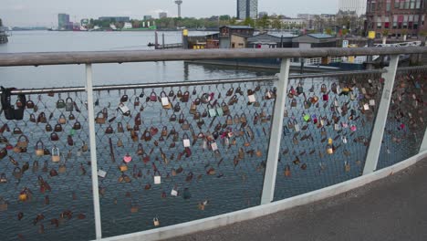 Padlocks-on-fence-of-love-lock-bridge-in-Rijnhaven-harbor-in-Rotterdam