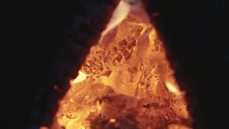 Burning-hot-firewood,-warming-up-in-winter-season,-close-up-view