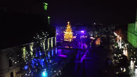 Kaunas-City-Hall-and-Christmas-tree-in-winter-season,-aerial-fly-forward-view