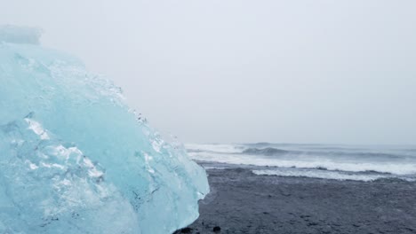 Big-chunk-of-ice-washed-ashore-of-breidamerkursandur-black-beach---diamond-beach-in-south-Iceland