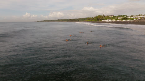 Surfers-Surfing-and-Catching-A-Wave-and-Falling-at-a-Beach-in-Bali