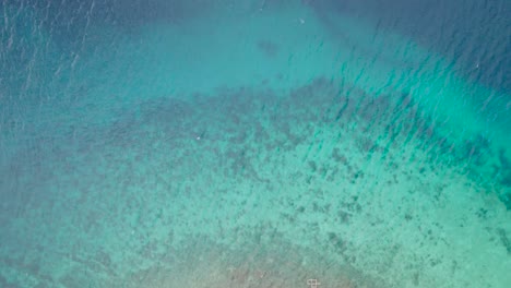Tio-Down-Aerial-View-of-Turquoise-Caribbean-Sea-Water-at-Coast-of-Saint-Thomas,-US-Virgin-Island,-High-Angle-Drone-Shot