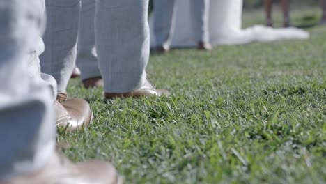 Close-up-shot-of-groomsmen-shoes,-lined-up-during-wedding-ceremony