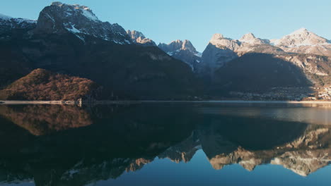 Mirror-Reflection-Of-Brenta-Dolomites-Through-Crystalline-Water-Of-Lake-Molveno-In-Trentino,-Italy