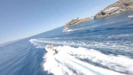 Epic-FPV-aerial-drone-fly-fast-around-moving-motor-boat-in-summer-holiday-spot