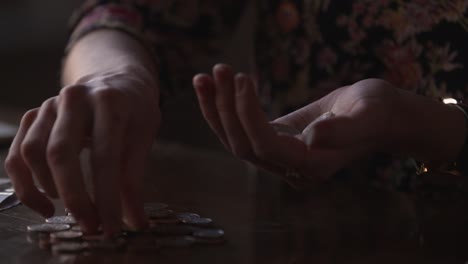 Women-counting-money-coins-in-SLOW-MOTION