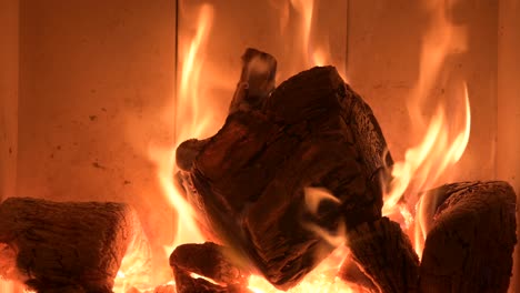 fire-element-concept,-flame-burning-chopped-wood-piece-in-fireplace-at-home
