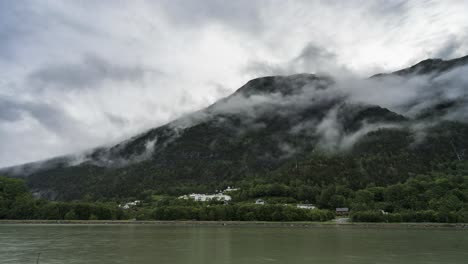 Clouds-Moving-Low-On-Green-Mountain---Rampestreken-Viewpoint-In-Andalsnes,-Norway---timelapse