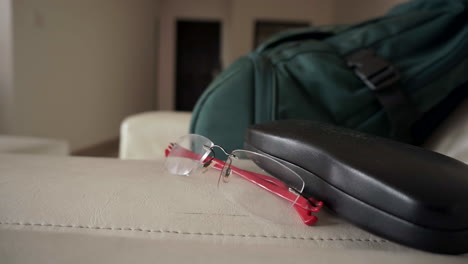 Wide-shot-of-a-pair-of-prescription-glasses-with-red-legs