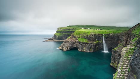 Scenic-waterfall-at-faroe-island-green-cliffs-motion-timelapse