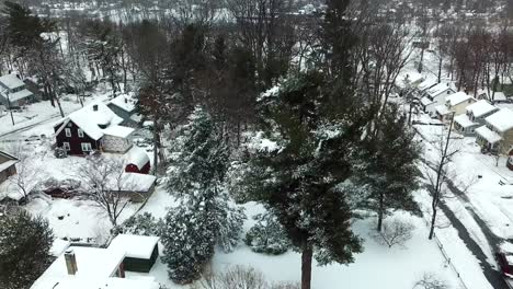 Snowy-reveal-Drone-shot-of-Suburban-neighborhood