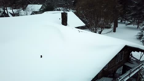 Snowy-push-in-of-Cabin-Drone-shot-of-Suburban-neighborhood