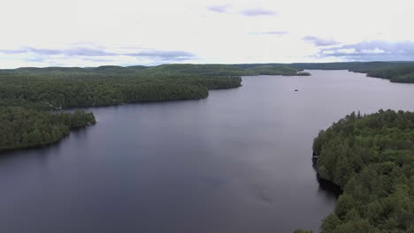 Wide-Angle-of-Drone-Flying-Forward-Over-a-Lake-in-the-Summer