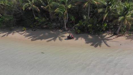 Cook-Islands---Riding-a-scooter-on-Aitutaki's-beach