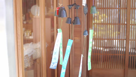 Wind-chimes-blowing-in-the-wind-in-Kyoto,-Japan-soft-lighting