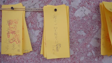 Lots-of-prayers-written-on-colourful-papers-hanging-on-temple-wall
