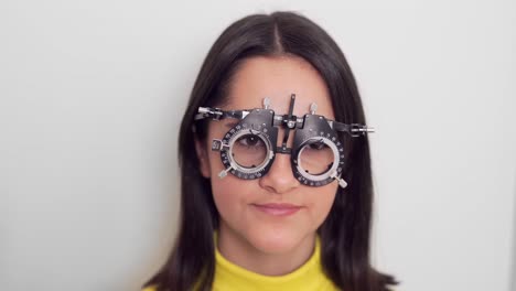 little-girl-trying-on-lenses-for-her-glasses