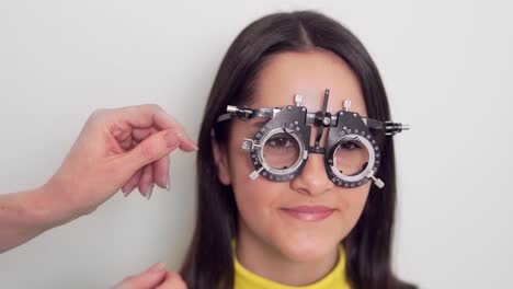 little-girl-trying-on-lens-at-optometrist
