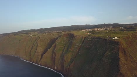 Aerial-view-of-the-shore-line-in-ponta-do-Pargo-and-view-of-the-light-house,-Calheta,-Madeira-island,-Portugal