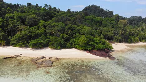 Tropical-island-with-sandy-beach,-coral-reef-and-jungle-shot-from-a-drone---Koh-Kradan,-Thailand,-Asia