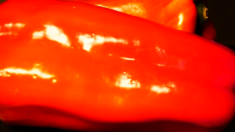 A-very-close-shot-of-two-red-peppers-rotating