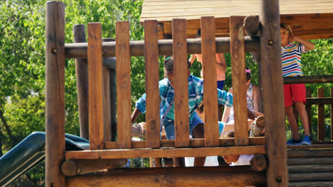 Schoolgirl-playing-on-slide-in-playground