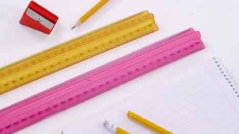 Scale-rulers-with-pencils,-sharpener-and-diary