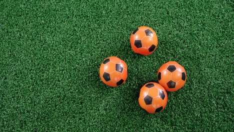 Footballs-on-artificial-grass-4k