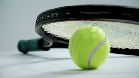 Racket-on-tennis-ball-4k