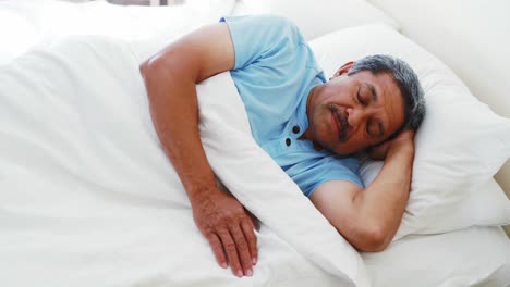 Senior-man-sleeping-peacefully-on-bed-4k