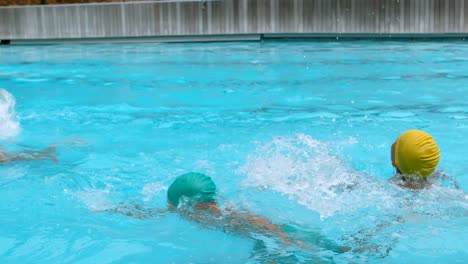 Kids-swimming-in-the-swimming-pool