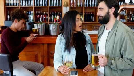 Couple-interacting-with-each-other-while-having-drink-4k