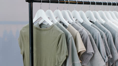 Various-t-shirts-arranged-in-a-row-on-cloth-rack-4k