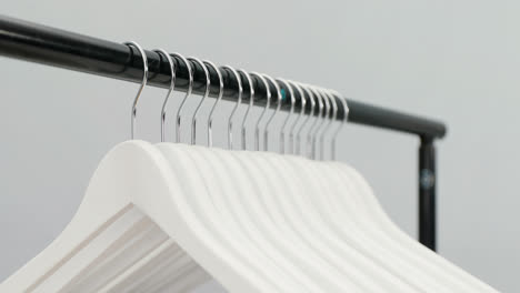 Hangers-arranged-on-clothes-rack-4K-4k