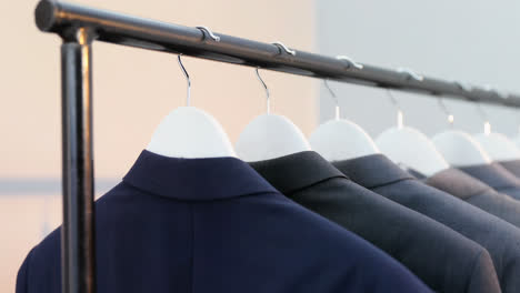 Various-blazers-arranged-in-a-row-on-cloth-rack-4k