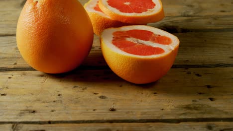 Grapefruit-on-a-wooden-table-4k