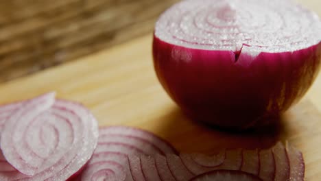Sliced-and-halved-onions-on-chopping-board-4k