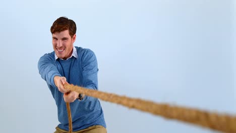Man-pulling-a-rope-against-white-background-4k