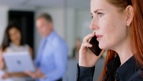 Businesswoman-talking-on-mobile-phone-4k