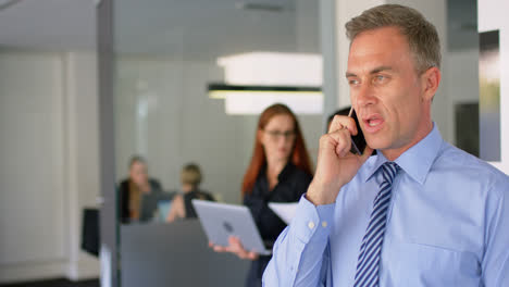 Businessman-talking-on-mobile-phone-4k