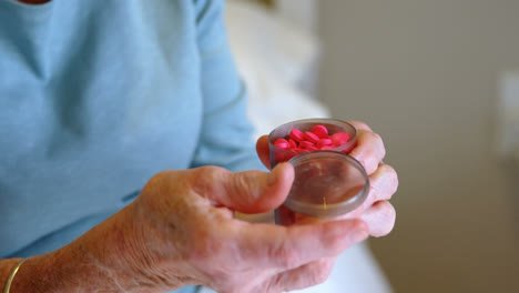 Senior-woman-taking-medicine-at-home-4k