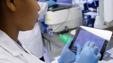 Scientist-using-digital-tablet-4k